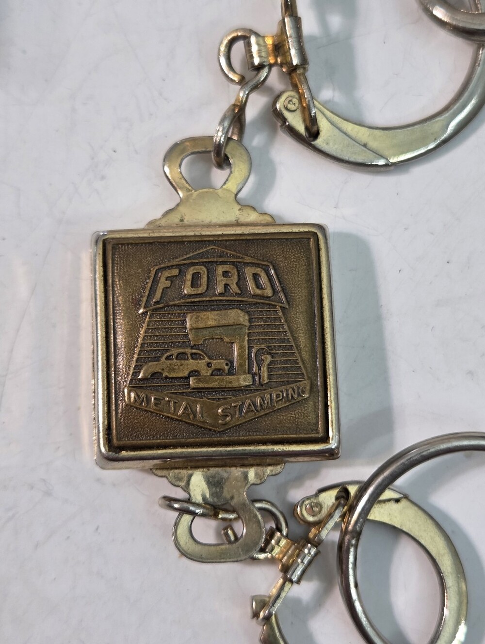 Ford Brass-Tone Metal Stamping Keychain Gold tone silver tone